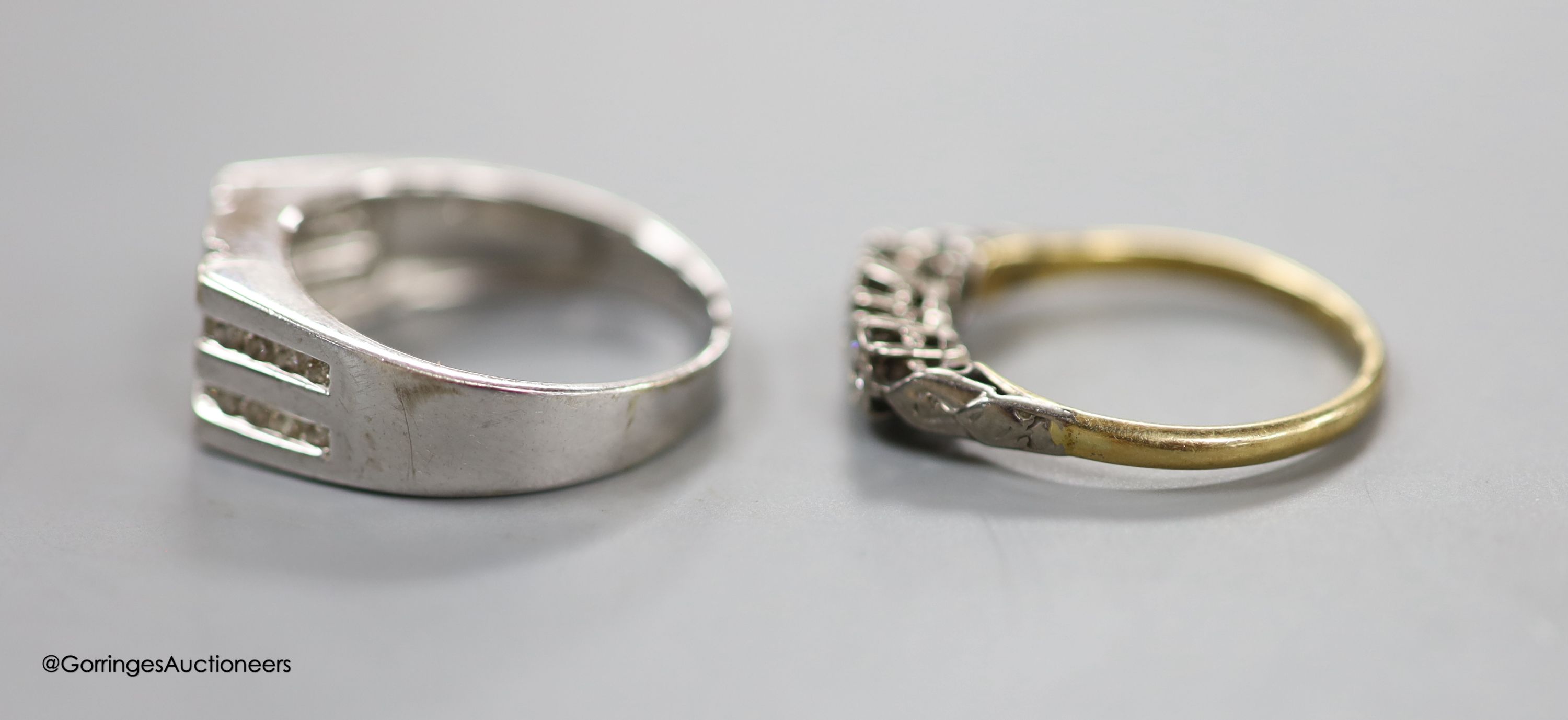 A diamond-set 14ct white gold ring, size R, gross 5.7 grams and an illusion-set three-stone diamond ring, 18ct gold shank, size P, gross 2.5 grams.